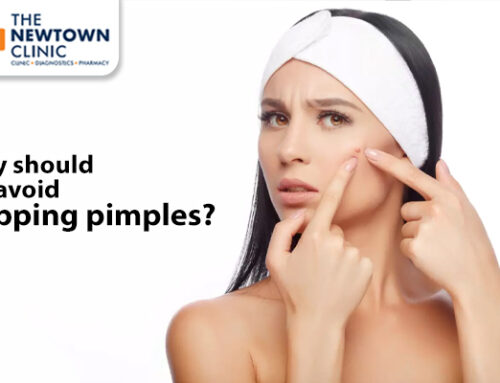 Why should we avoid popping pimples?